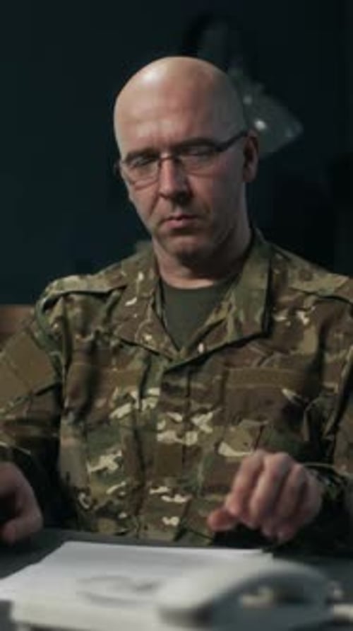 Commander Reviewing Contracts in Command Hub, Vertical Portrait