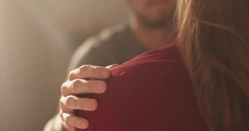 Couple, hands and shoulder with touch for support, love or emotional comfort together at home