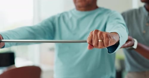 Man Doing Physical Therapy with Helper