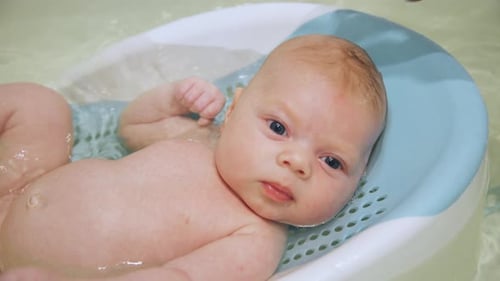 Cute Baby Having Bath Time Fun