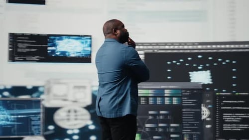 Black Programmer Expert Engaging in Software Development at High Tech Workspace