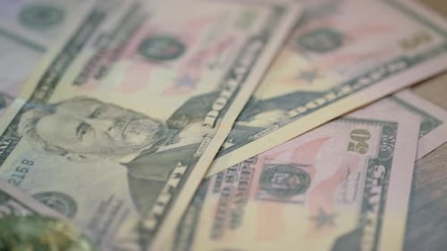 Bitcoin and gold cryptocurrency concept on us dollar banknotes background