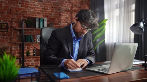 Professional Man Working in Modern Office Setting
