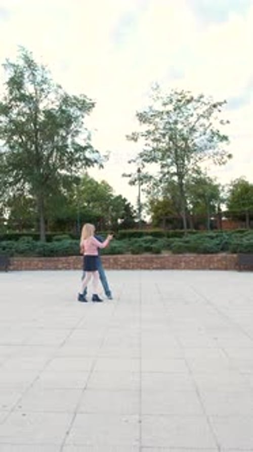 Mature Couple Dancing Tango in a Park at Street