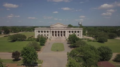 Aerial drone shot of white house with drone moving forward toward the white house.