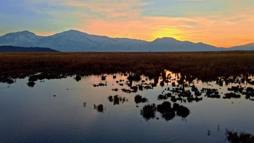 Scenic Lake and Mountain Landscape at Sunset