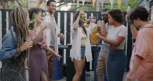 Young Adults Dancing at Outdoor Party