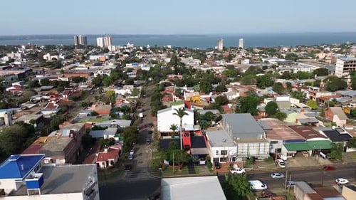 Panning aerial movement and cityscape at Posadas intermediate residential areas, Argentina.