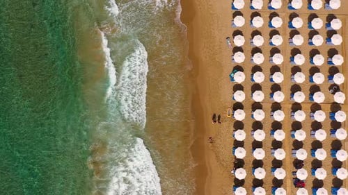 Concept of summer vacation. View from above, stunning aerial view of an amazing beach with beach umb