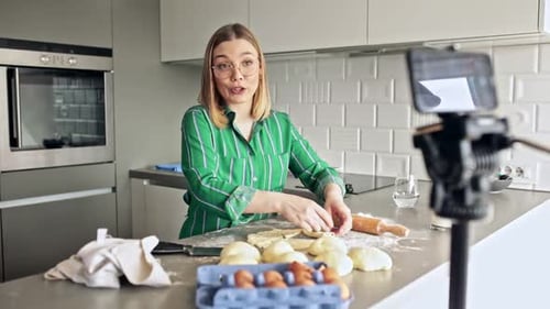 Woman Baking Dough in Modern Kitchen