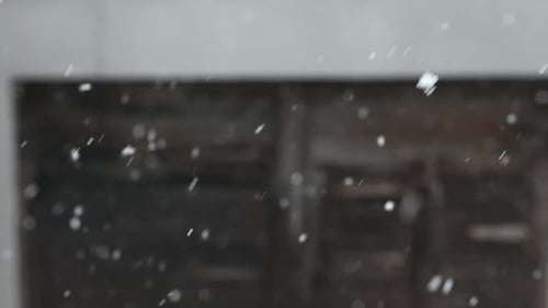 Slow motion of snow in spring. Blurred background