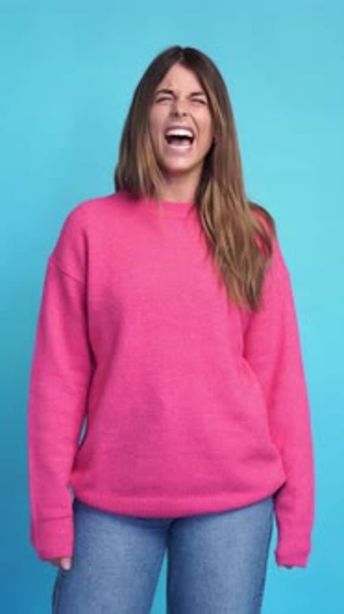 Woman Laughing and Yelling on a Blue Background