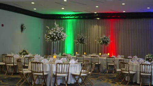 Colorful and elegant meeting room in a hotel, decorated for a wedding reception celebration, round t