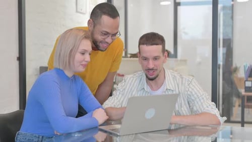 Colleagues Collaborate with Video Call at Workplace