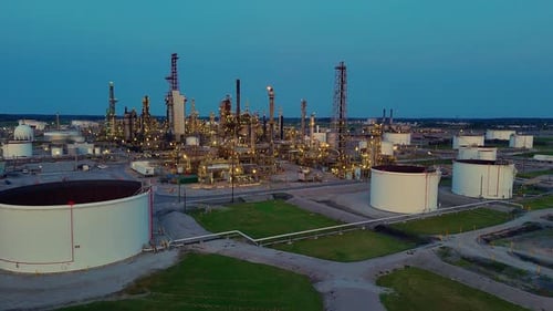 Cenovus Oil Refinery complex with large fuel tanks in Toledo, Ohio, aerial evening view