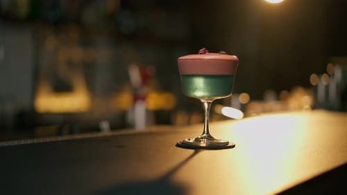 Cocktail with Rose on Bar Counter in Restaurant Pub Orange Drink with Juice Fresh Prepared Alcoholic