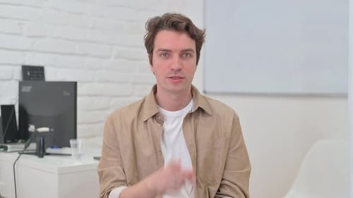 Portrait of Young Creative Man Showing Silence Gesture