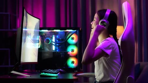 Teen Gamer Playing Exciting Computer Game At Home