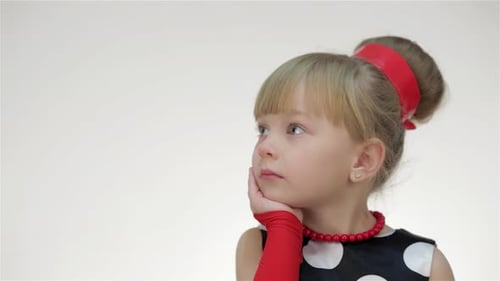 Curious Girl Gazing Thoughtfully Into Space