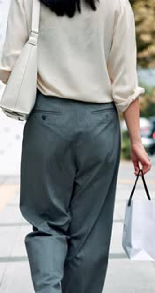 Back, shopping bag or woman in city walking to retail outlet with fashion choice