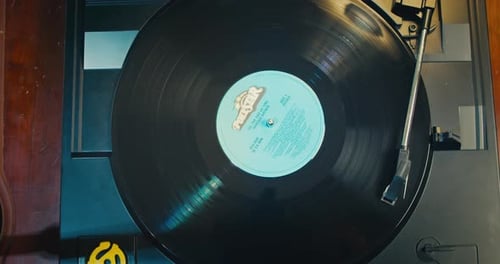 Vinyl Player Top View The Needle is Lowered Onto an Old Vinyl Record