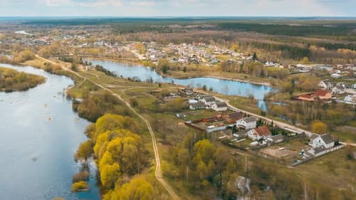 Timelapse Dronelapse Hyperlapse Aerial View Early Spring Forest Woods And Curved River Near Village