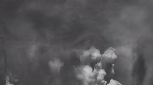 cumulonimbus clouds growing in the sky accompanied by lightning.