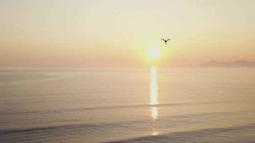 Drone flying while sunset / sunrise above the ocean - Professional production - Quadcopter - DJI Ins