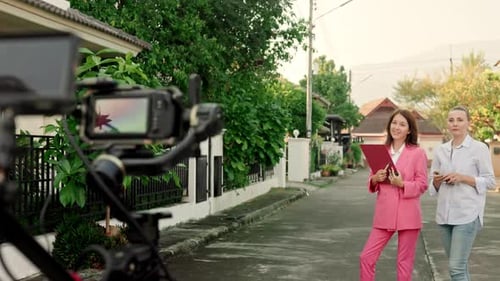 Women Filmed on Suburban Street for Corporate Video