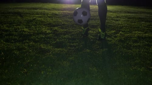 Soccer Player Athlete Training Foot Ball Sport on Soccer Field at Night