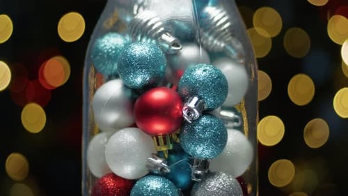 Festive Christmas Ornaments Inside a Decorative Jar