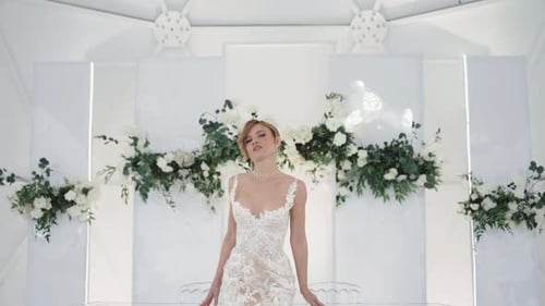 Elegant Woman Posing in White Lace Dress
