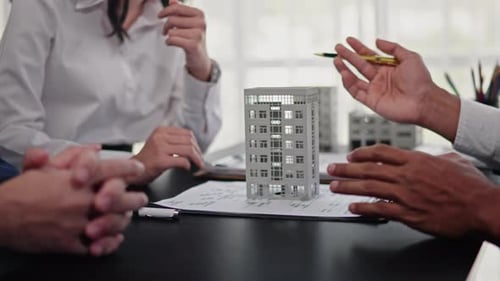 Businesspeople sell buy mortgage and signing agreement for apartment financial