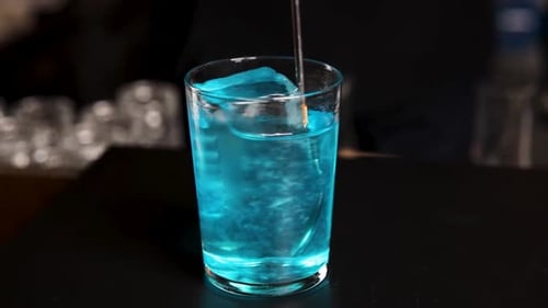 the bartender prepares a cocktail at the bar