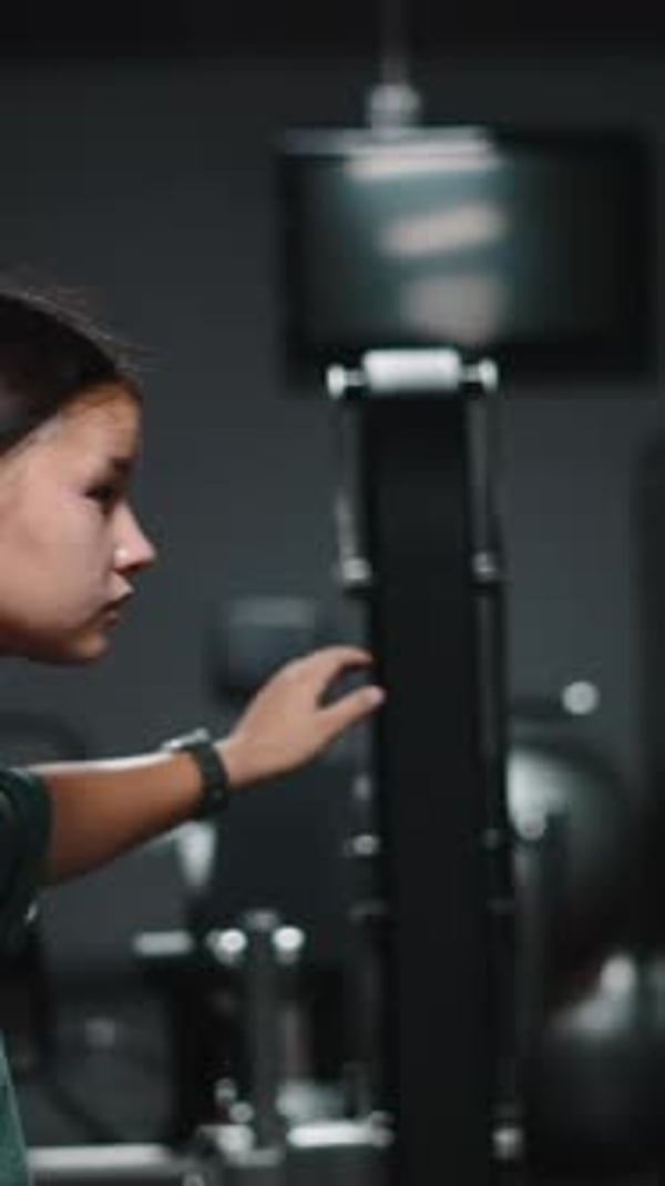 Woman Exercising on Rowing Machine at the Gym, Sports Stock Footage ft ...
