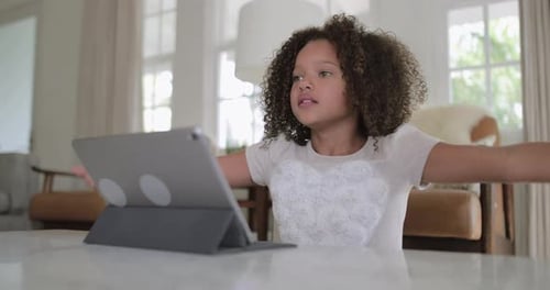 Girl Using Tablet Device with Hand Gestures
