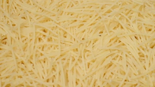 Uncooked Yellow Noodles Piled High, Close Up