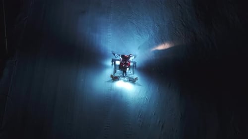 A Snow Groomer Works in Courchevel France at Night Creating a Beautiful Winter Scene