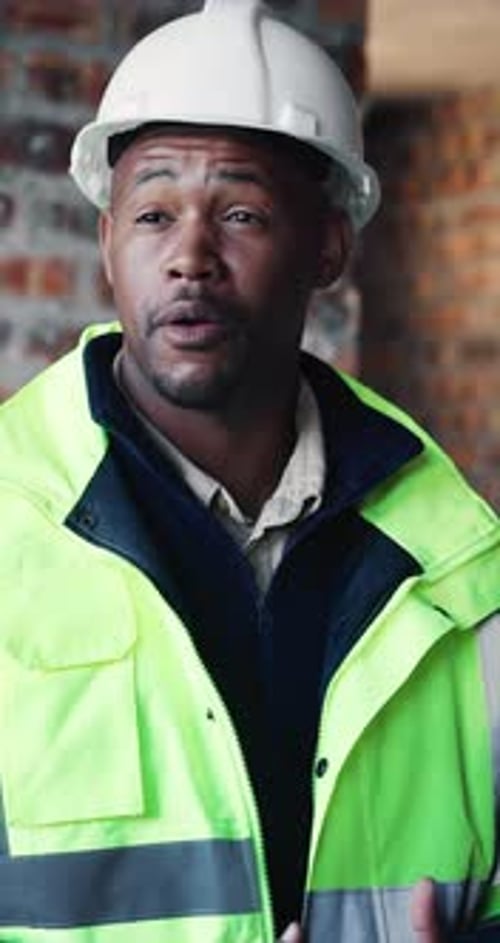 Discussion, black man and construction worker on site with planning for renovation