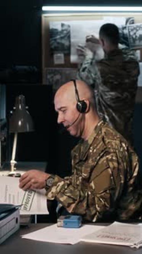 Officer Transmitting Data, Colleague Working on Noticeboard in Military Office