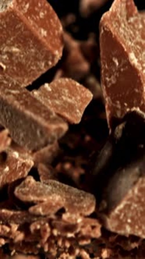 Super Slow Motion Pieces of Dark Milk Chocolate Filmed on a Highspeed Camera at 1000 Fps