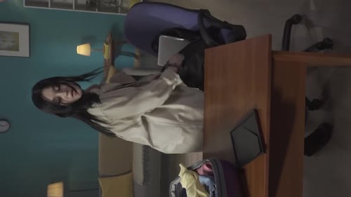 Video of a Teenager Teen Young Woman Packing Her Belongings in a Suitcase and Backpack She Looks at