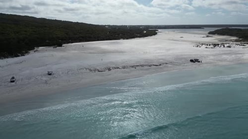 Cars parked on sandy beach, Bremer Bay in Western Australia. Aerial drone view