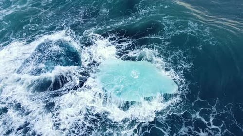 Iceberg in the Ocean Huge Chunks of Blue Ice Floating on the Waves Beautiful Arctic Landscape Aerial