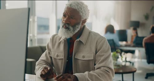 Thinking, man and reading on computer in office for research, review article and editing draft