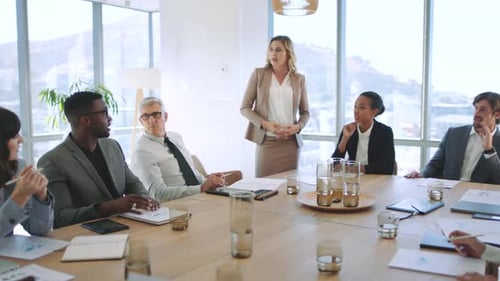 Presentation, training and learning workshop in an office with a business woman talking to her team