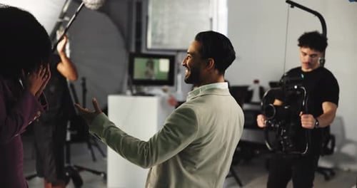 People, director or team with applause in celebration for filmmaking or production on set