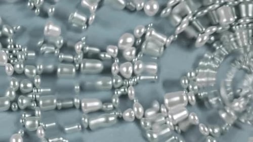Pearls Arranged in Decorative Fashion on Blue Fabric