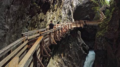 Walkbridges in a gorge surrounded by waterfalls in Austria.