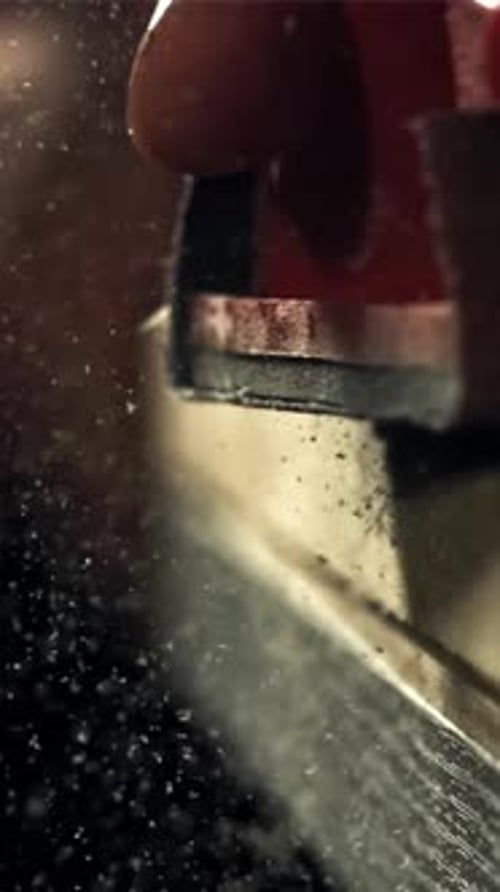 A Carpenter Sands a Wooden Plank Filmed on a Highspeed Camera at 1000 Fps